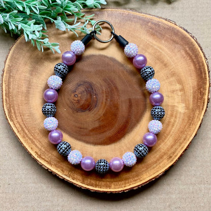 Purple spiderwebs beaded dog collar by Bully Love Boutique, featuring colorful beads and a playful spiderweb design.